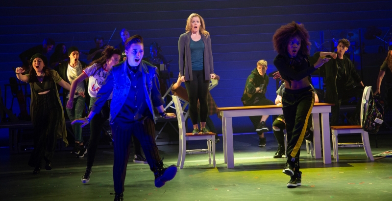 Elizabeth Stanley as Mary Jane Healy (center) and the chorus perform a song from Jagged Little Pill at American Repertory Theater.