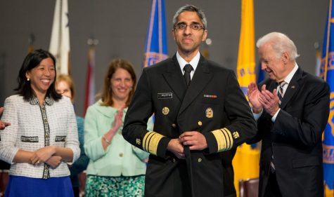 Surgeon General Vivek Murthy, pictured during his 2015 swearing-in ceremony, joined presidential candidate Joe Biden (right) during his remote conference call with voters Monday, March 16, 2020.