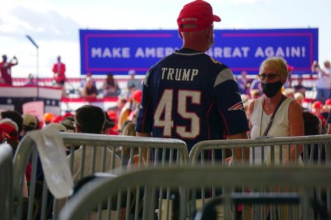 A man wears a Trump-themed New England jersey at a Trump rally in Londonderry, N.H., Friday.