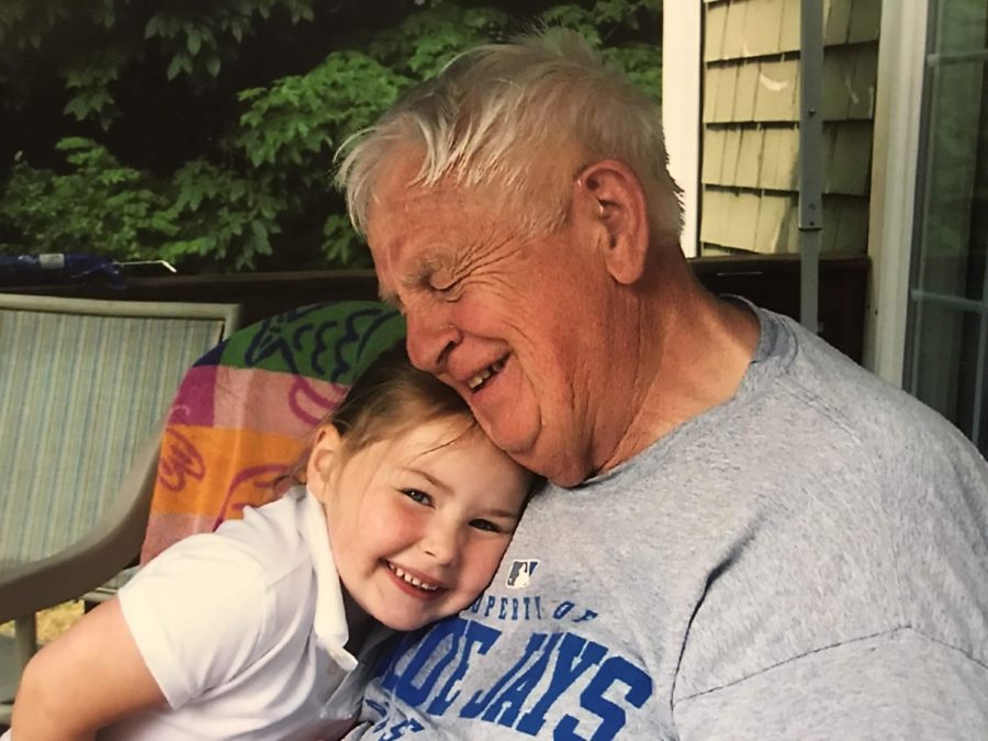 My grandpa and I together, years before he contracted Covid-19 and passed away.