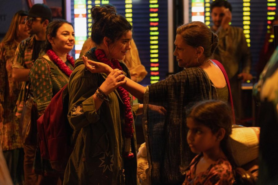 Kamala and her mother are welcomed at the airport by their relatives living in Pakistan in a scene from 