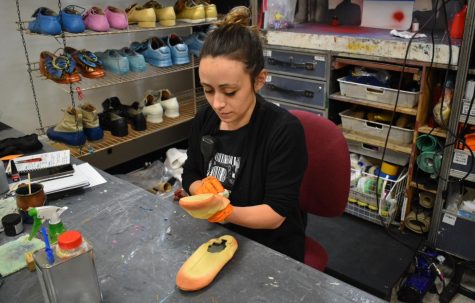 Charlotte Foret, shoe technician for Cirque du Soleils Corteo, works in a back room of Agganis Arena taking care of the 200 pairs used by the performers during the four-day run in Boston.