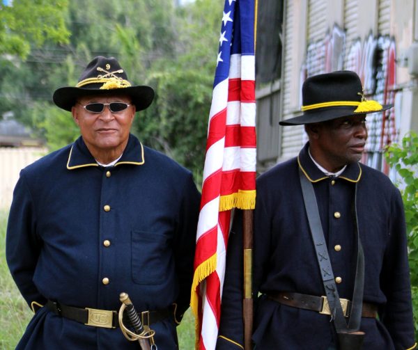 The Buffalo Soldiers stand formally waiting for the beginning of the Juneteenth Parade in Austin, Texas. They represent Black soldiers during the Civil War who helped to fight for the unification of the United States. (June 17, 2023)