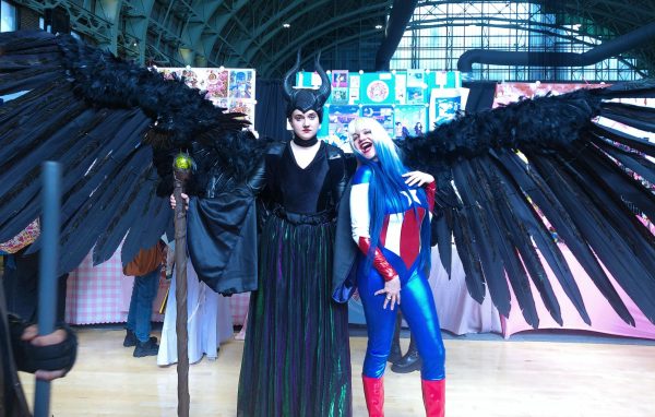 A Maleficent cosplayer spreads her wings around Captain America at Brooklyn Comic Con on Sunday, June 9, 2024, at Major R. Owens Community Center.