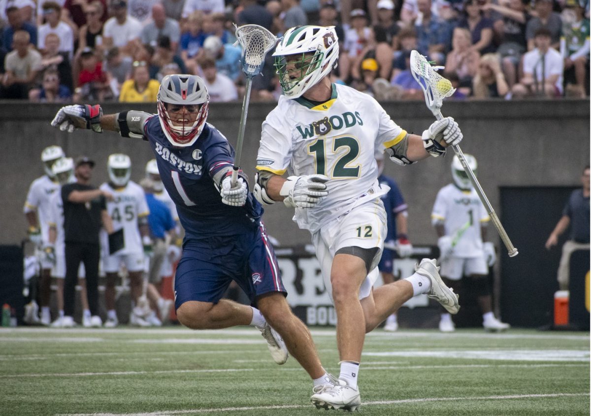 The Boston Cannons Marcus Holman (left) tries to hit the ball away from Brian Tevlin during a 9-7 victory by the California Redwoods as part of Premier Lacrosse League action July 5, 2024, at Harvard Stadium. 