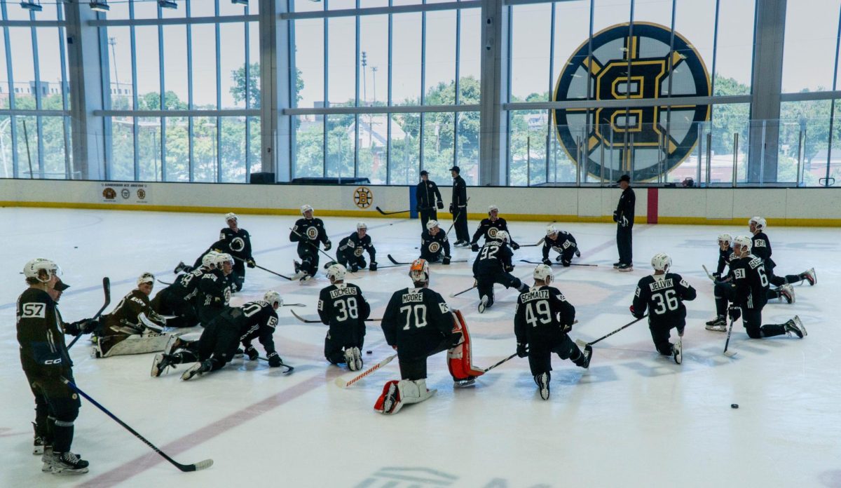 Current and prospective Bruins players stretch after finishing their second day of their annual development camp July 2, 2024, at Warrior Arena.