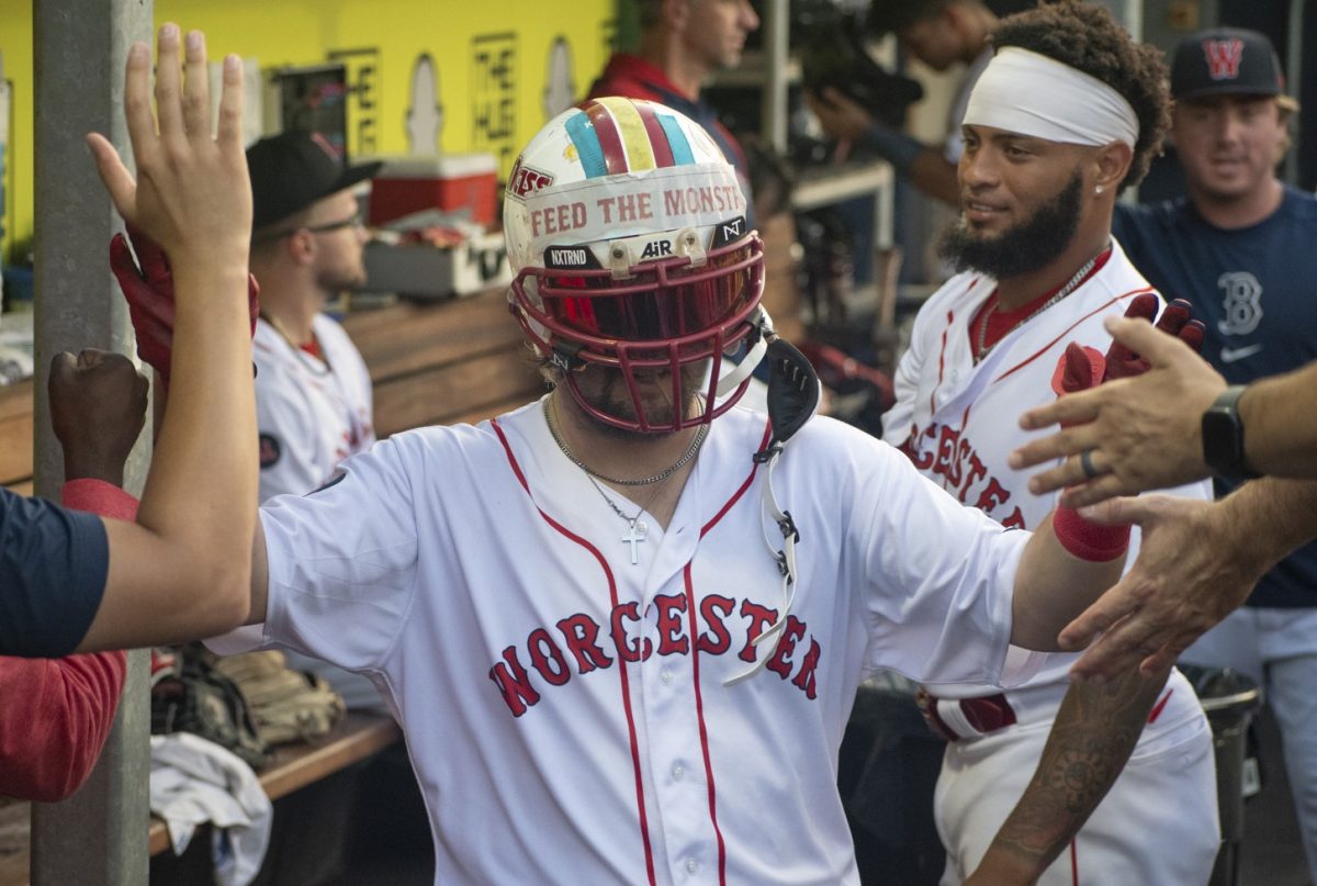 Nathan Hickey is fed a diet of high-fives after hitting a solo home run in the third inning of the WooSox's 11-6 victory over the Buffalo Bisons on July 30, 2024, at Polar Park in Worcester. 