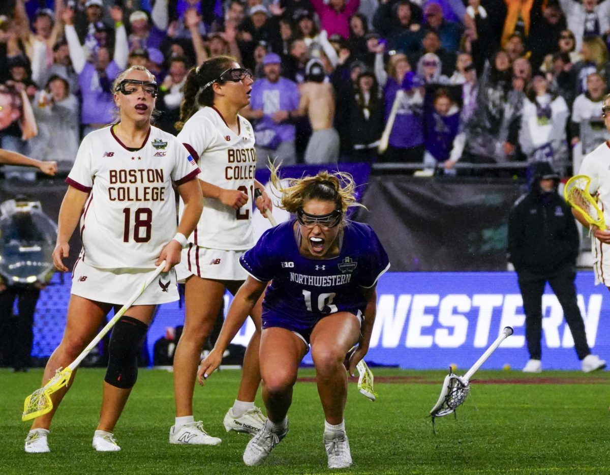 Northwestern senior Sam Smith (center) is jubilant after scoring the go-ahead goal late in the fourth quarter of a 12-11 upset win over Boston College in the NCAA Division 1 women's lacrosse semifinals on May 23, 2025, at Gillette Stadium.
