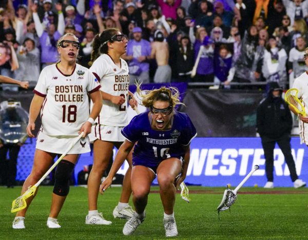 Northwestern senior Sam Smith (center) is jubilant after scoring the go-ahead goal late in the fourth quarter of a 12-11 upset win over Boston College in the NCAA Division 1 women's lacrosse semifinals on May 23, 2025, at Gillette Stadium.
