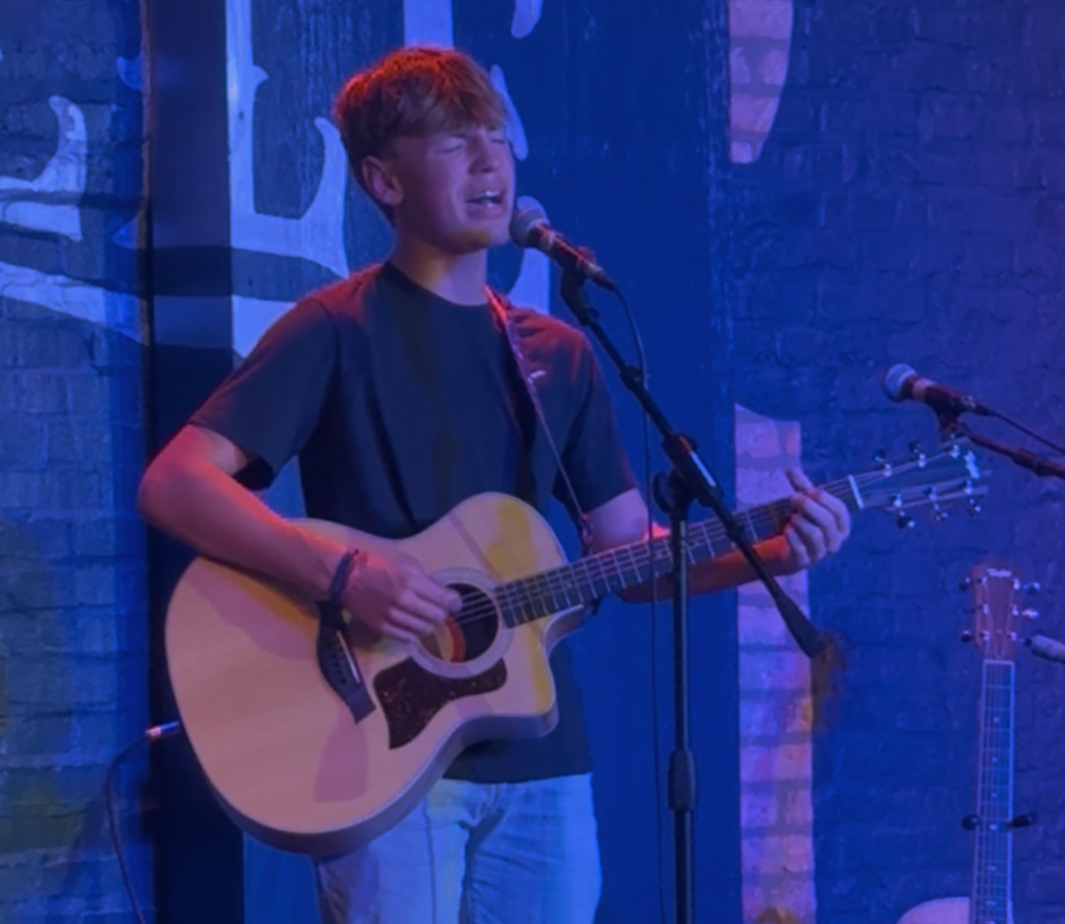 Connor Ray, 14, takes the stage during an open mic night at Little Nashville on June 22, 2025. (Photo courtesy of Connor Ray)