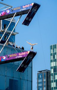 Scenes from the first day of the Red Bull Cliff Diving World Series season finale, in which male and female competitors leaped from the Institute of Contemporary Art museum into the Boston Harbor on Sept. 19, 2025.